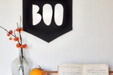 23 a simple BOO sign of black paper or fabric can be hung anywhere you want