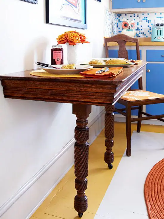 a wooden half table with casters is a great idea for small eat-in kitchen like this one