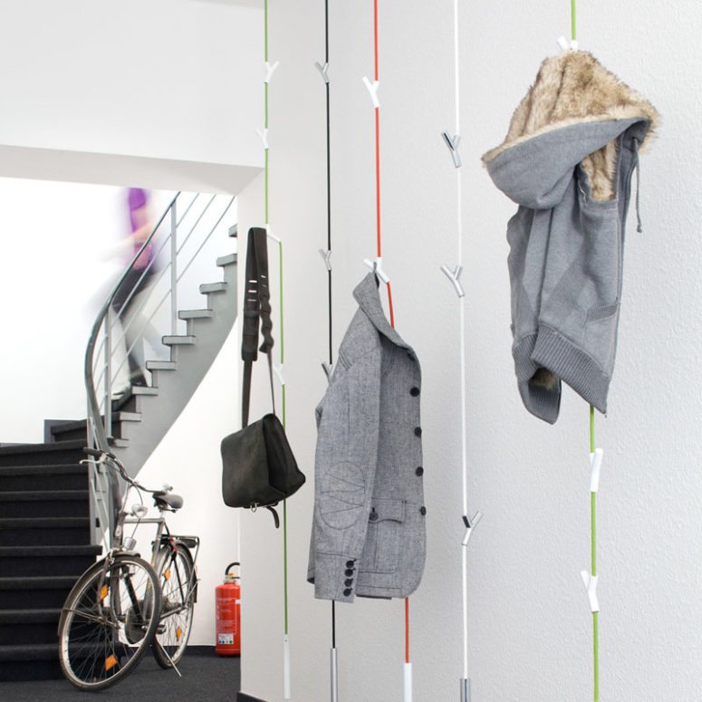 these hanging coat racks have 4 adjustable Y shaped hooks to hold your coats and bags and a weight at the bottom to keep the rack from swaying too much