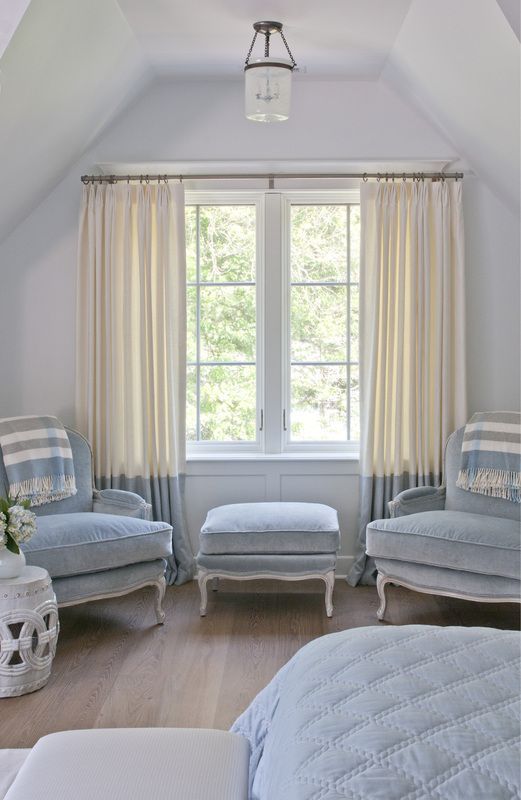 color block curtains in cream and powder blue matches the color palette and adds an edgy feel