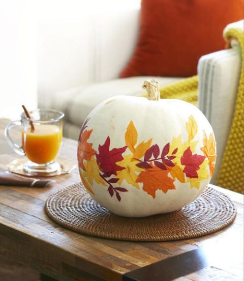 decorate a faux pumpkin with fall leaves using decoupage techniques and display it for the fall and Thanksgiving