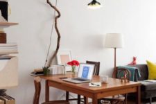 24 light up your space in an original way hanging some lights on a long tree branch over your desk