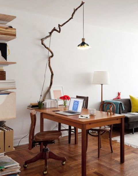 light up your space in an original way hanging some lights on a long tree branch over your desk