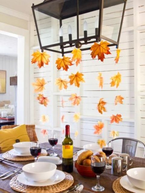 if you have a chandelier hanging over the table, hang some fall leaves on threads down