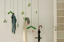 25 make a colorful and whimsy statement with such a coat rack hanging from above and colorful hooks and hangers
