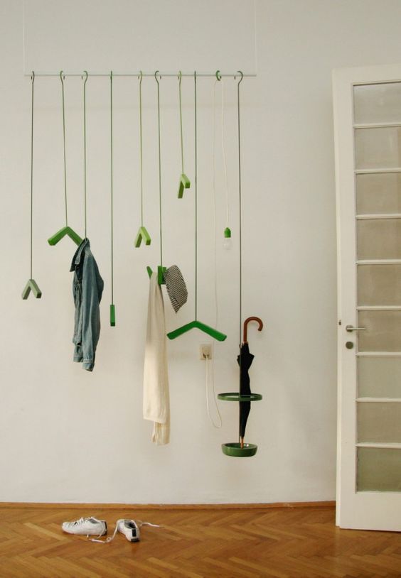 make a colorful and whimsy statement with such a coat rack hanging from above and colorful hooks and hangers