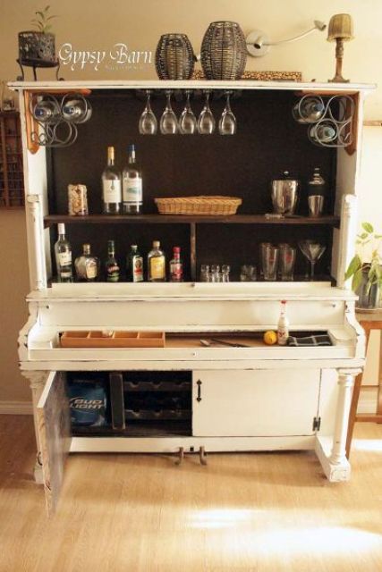 a home bar in white made of an old piano is a cool and bold idea that guarantees an original look