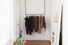 26 such a simple coat rack attached to the ceiling is a minimal and stylish solution to rock in a small space