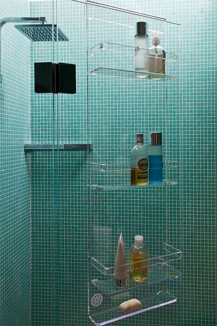an acrylic shower caddy looks ethereal and floating in the air