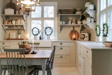 a neutral Scandinavian kitchen with shaker cabinets, a neutral vintage dining set and open shelves