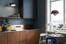 a moody kitchen with limewashed walls
