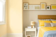 25 pastel yellow walls and bright yellow bedding and pillows create a very warm ambience