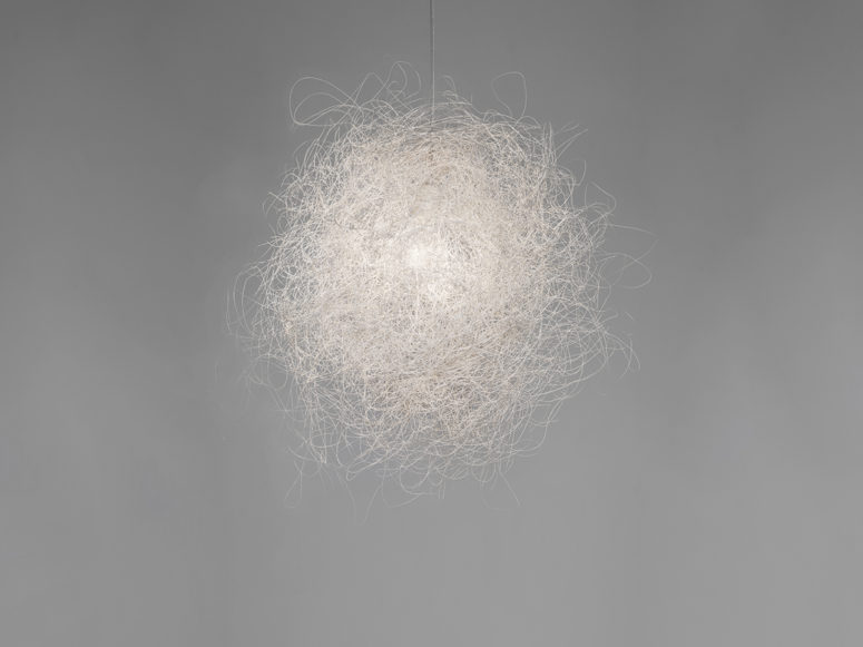 Pili is a unique lamp that resembles a cloud, it's composed of a single stainless steel thread interwoven
