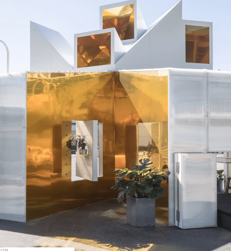 The house is done in white and gold, there's much geometry in its exterior
