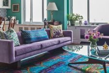 02 a bright open layout with colorful furniture with a bright printed rug and bold walls