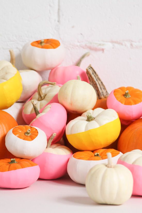 an arrangement of bright color block pumpkins can be stacked on a mantel or your dining table