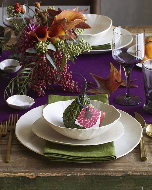 a bright purple table runner, green napkins and a super bright floral centerpiece to enjoy the colors