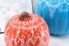 05 bright pumpkins with henna decor on them to add a colorful touch and a boho feel to the space
