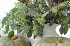 05 some heirloom pumpkins, seeded eucalyptus and feathers will make up a nice Thanksgiving display with a boho feel