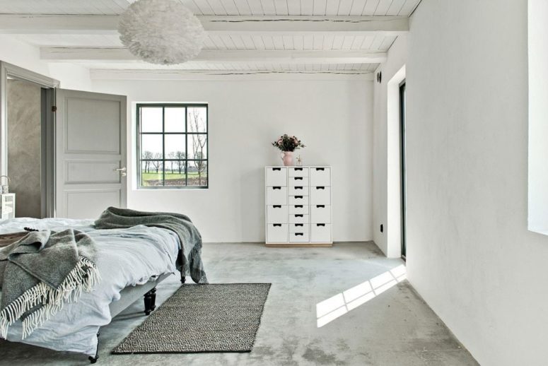 The spaces are neutral but don't look boring due to textures used - concrete, wood, yarn in decor