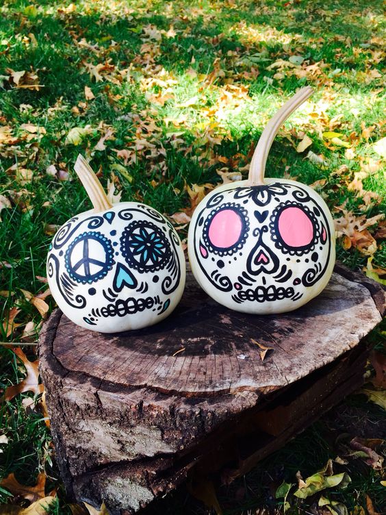 bright sugar skull inspired Halloween pumpkins decorated with usual sharpies