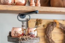 06 copper mugs and a pitcher are a great idea to create a chic Thanksgiving bar that invites