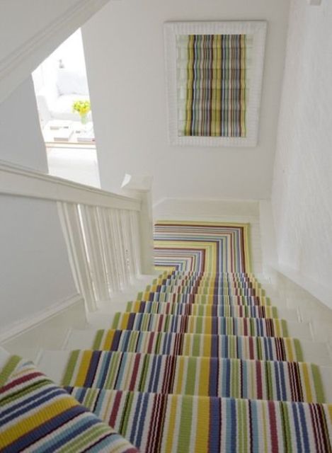 a colorful striped carpet is a simple and quick idea to make your staircase bright, colorful and fun