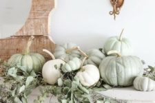 07 simple rustic mantel styling with white and green heirloom pumpkins and fresh eucalyptus for Thanksgiving