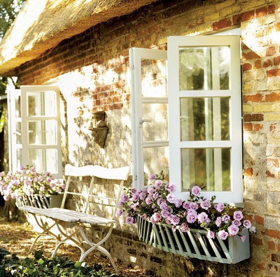 window boxes are traditional for cottages and you may easily change the look from season to season with them