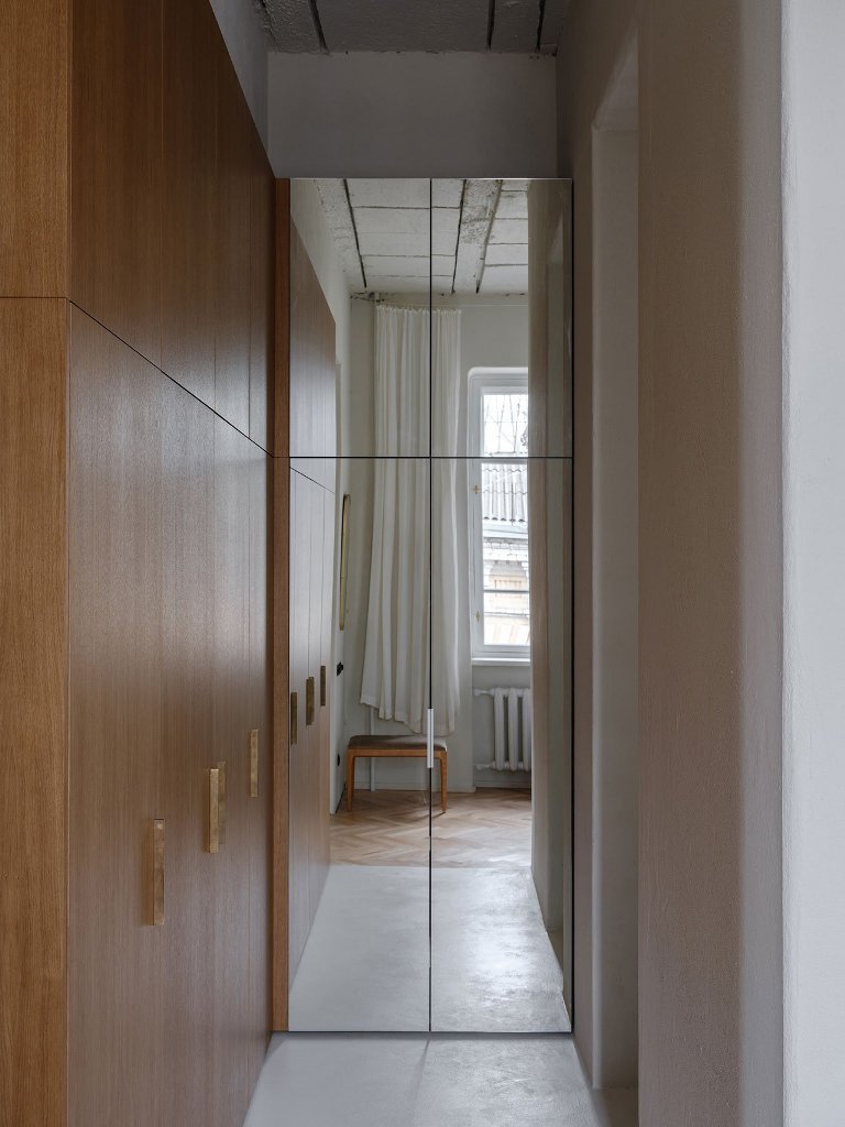 The storage is hidden in an elegant way, there's a closet next to the bedroom with enough light and mirrors
