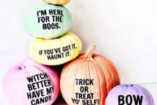 08 an arrangement of Halloween pumpkins with fun and quirky phrases on them for a modern touch