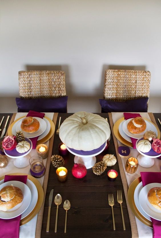 a colorful rustic tablescape with touches of purple, fuchsia and hot pink plus gold