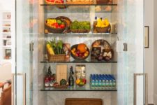 10 a large fridge with glass doors and glass shelves is a great extra display and it will make the kitchne fele more open