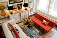 10 an eclectic living room with a bright gallery wall with vintage posters and artworks