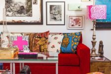11 a colorful and bright living room with super bold artworks covering the whole wall