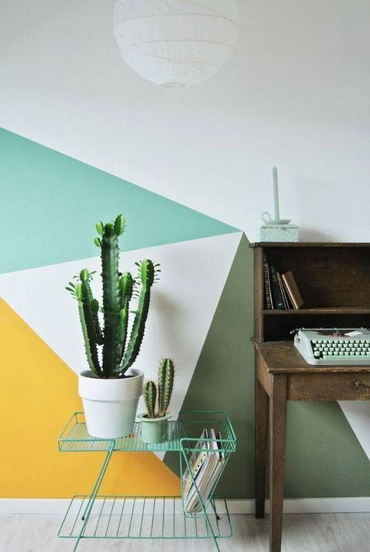 a home office spruced up with green, emerald, yellow and white and a geometric look