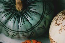11 henna and wood burnt pumpkins are a cool and unusual idea for a boho chic Halloween