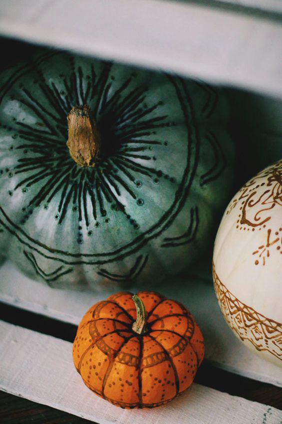henna and wood burnt pumpkins are a cool and unusual idea for a boho chic Halloween