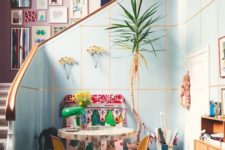 13 a colorful space and a pink wall that is completely covered with bright artworks for a bold touch