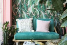 13 bold leaf printed wallpaper is paired with a simple and neutral printed rug and a polka dot pillow