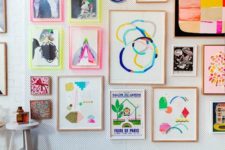 15 a colorful modern gallery wall with decorative plates,colorful frames and neon touches