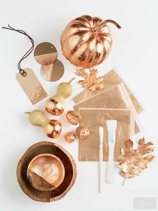 Copper bowls, leaves, acorns, faux pears and tags will make your tablescape bold, bright and glam like