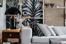 15 dramatic moody wallpaper takes over the space and chevron pillows on the sofa add more interest