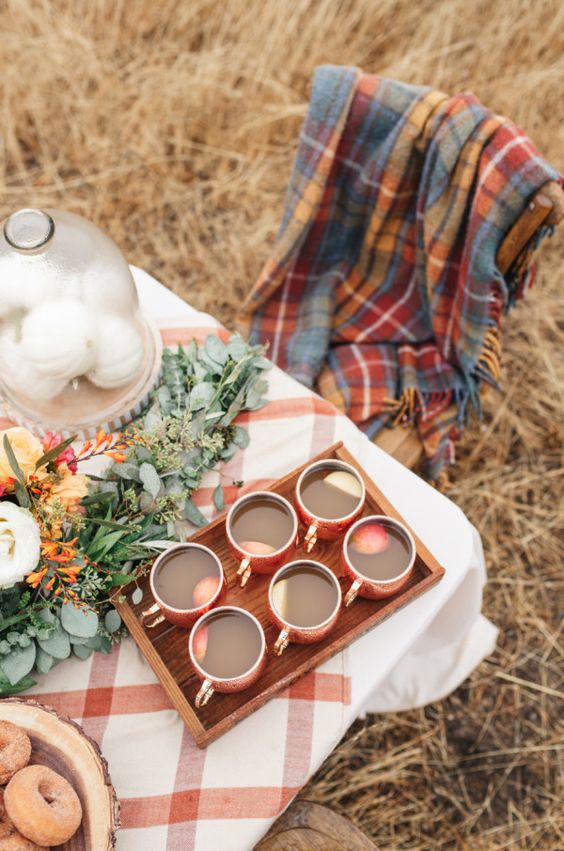 offer some plaid blankets and throws that match the table decor for a cozy fall-like look
