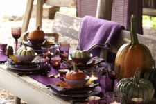 15 purple as the main jewel tone, for the table runner, napkins, glasses and candle holders and heirloom pumpkins