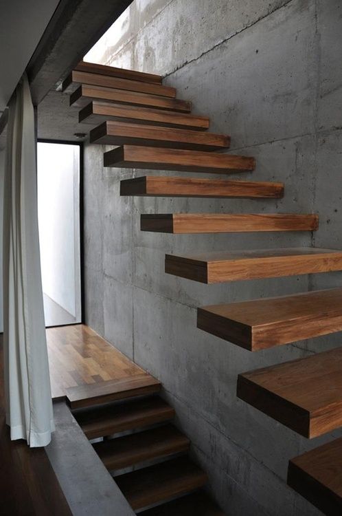 this floating staircase looks really ethereal, as if it's floatign in the air