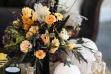 17 a lush floral centerpiece with fall blooms, greenery and black touches is what you need for a chic look