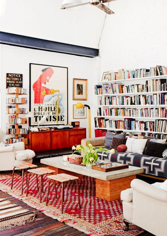 lots of books placed on the walls are great for maximalist spaces