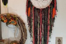 18 a gothic boho drema catcher in bold orange and black is a cool Halloween decor option