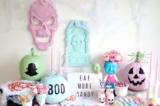 18 a pastel Halloween candy bar with painted pumpkins, skulls and ugly dolls